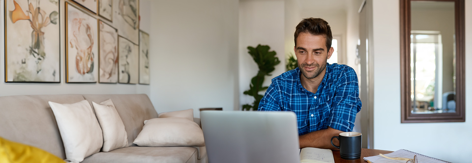 man at home on his laptop