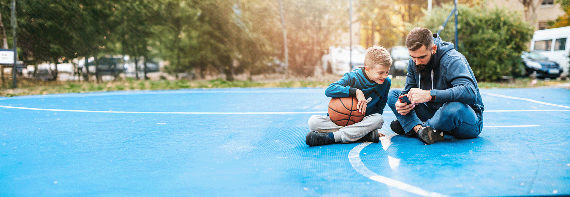 father and son on basketball court