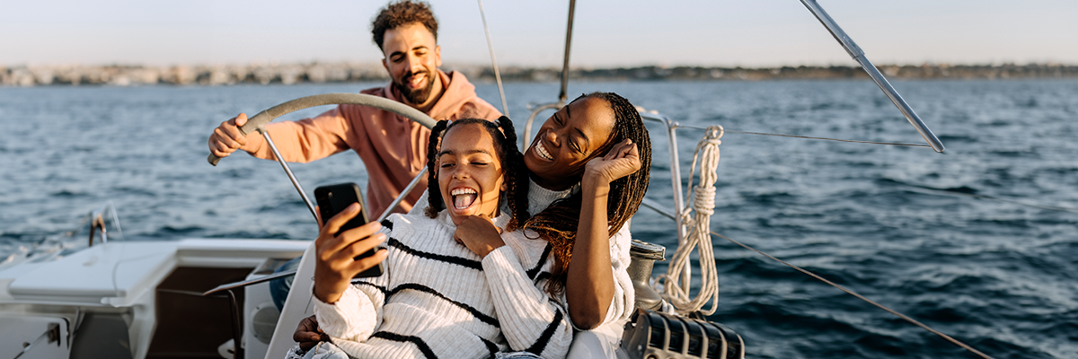 people on a boat taking a selfie photo