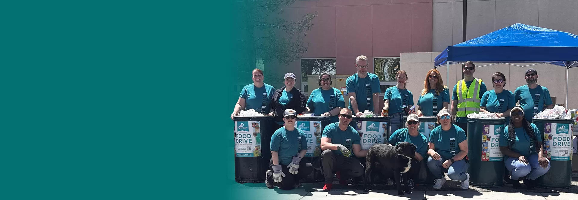 shred day volunteers standing around food donation barrels