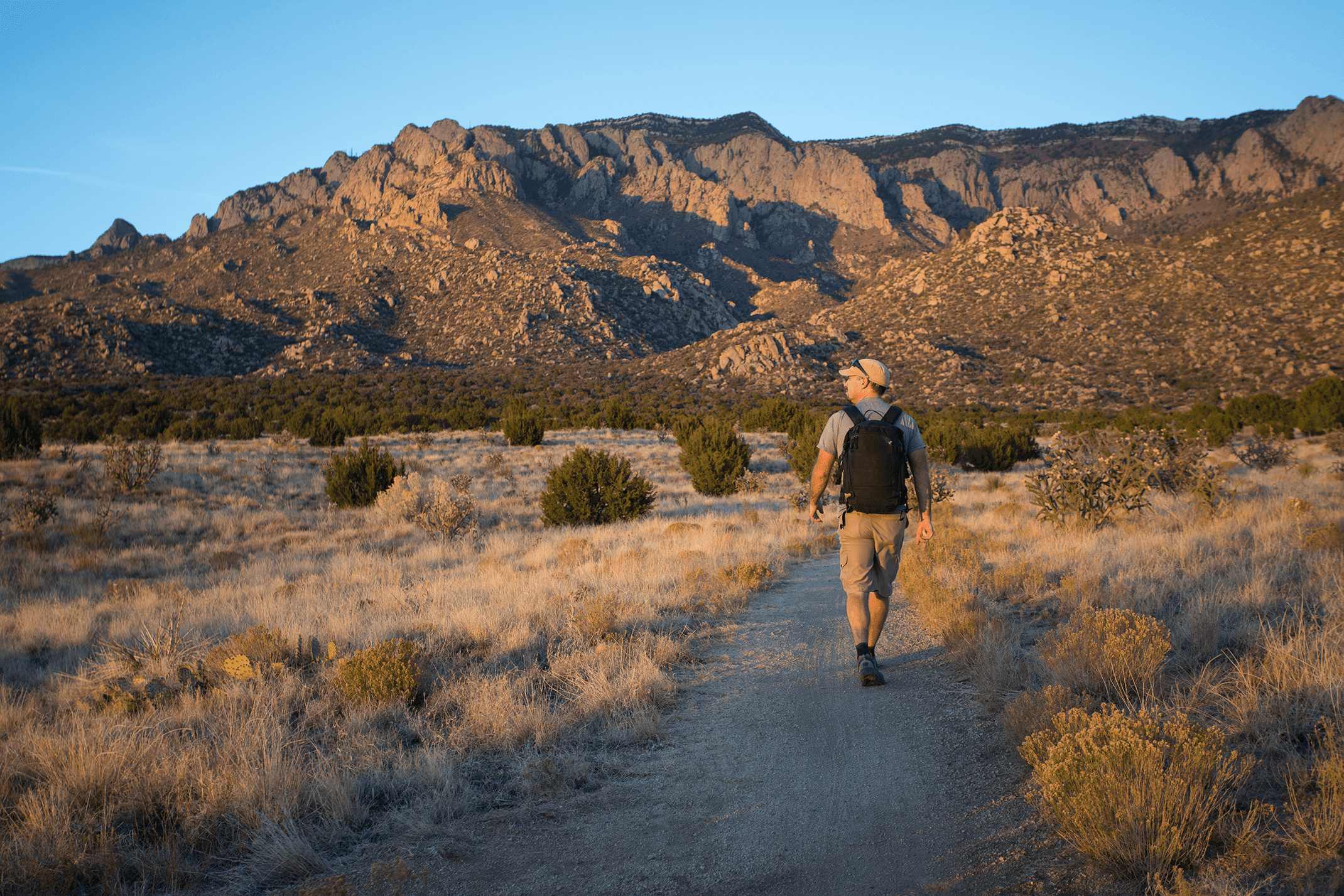 man hiking in sandia mountains