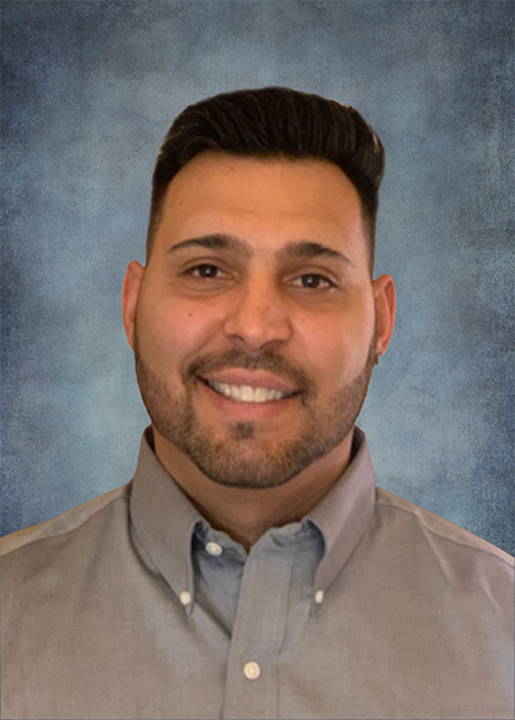 Alonzo Rael headshot wearing a gray button up