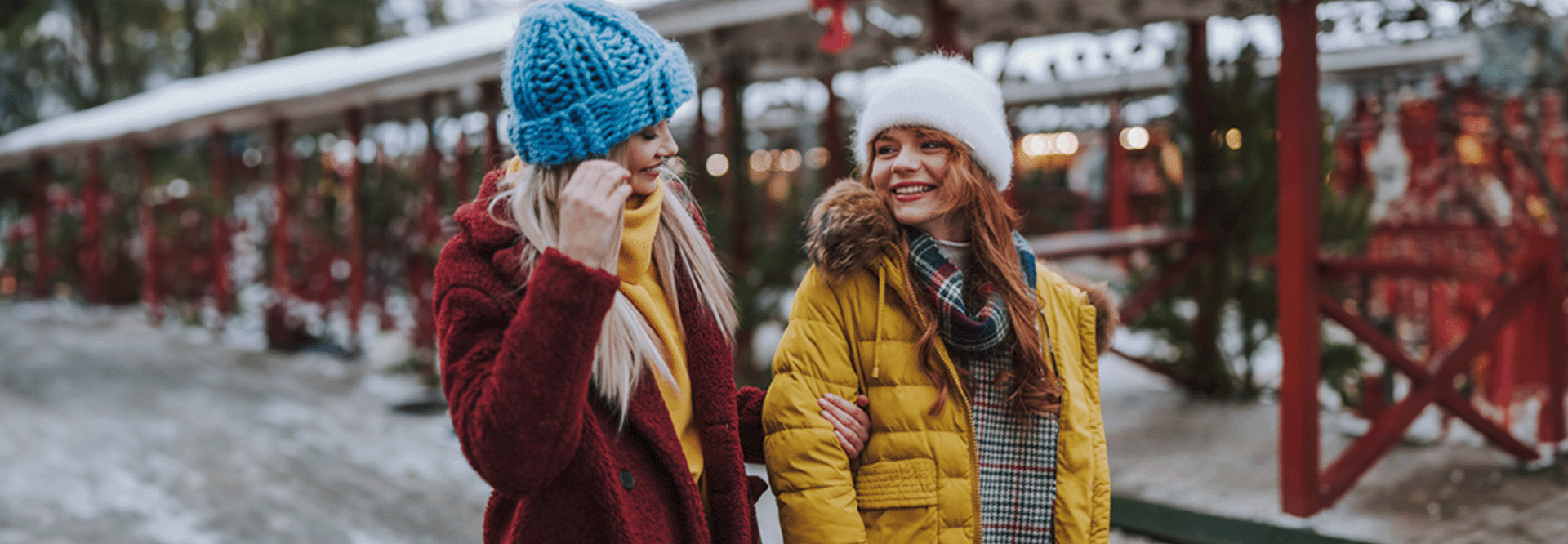 two women walking outside bundled up