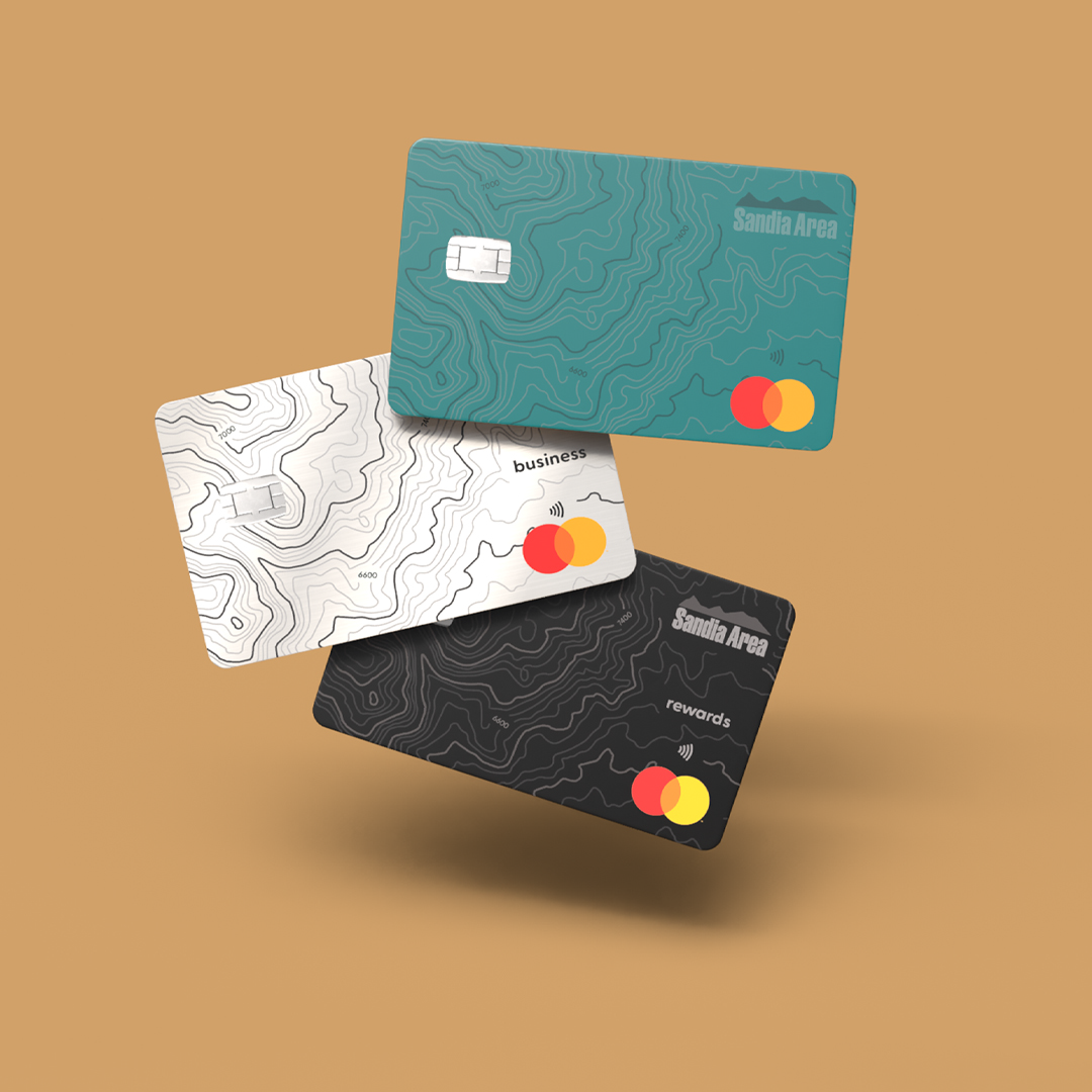 3 credit cards stacked on a gold background