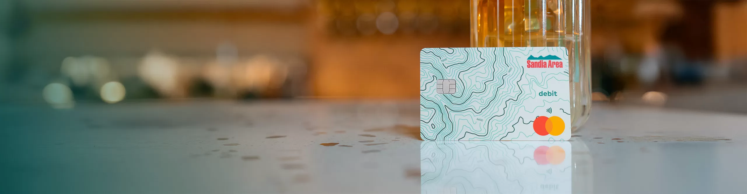 sandia area debit card sitting on a table