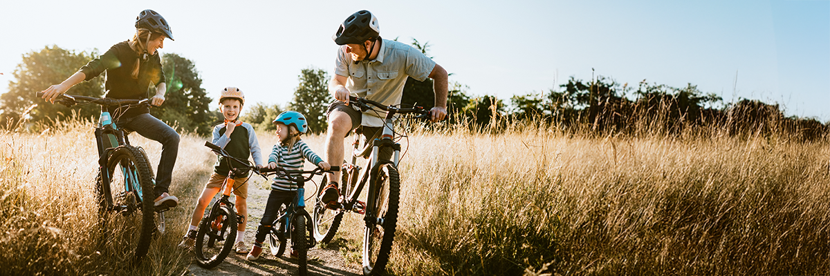 family on a bike ride in nature