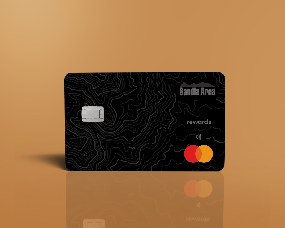 Black credit card on gold background