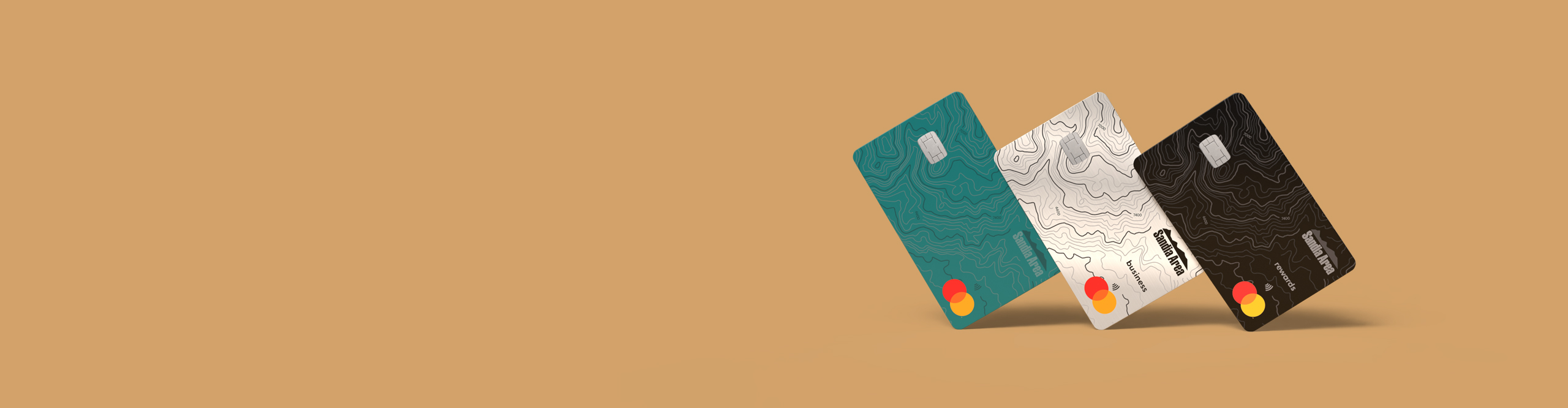 three credit cards, one teal, one silver, one black, on a gold background